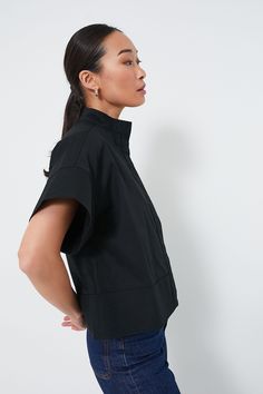 The Black Sofia Shirt is the elevated style staple your closet needs. A short sleeve button down with a slightly cropped hem and a boxy silhouette that's perfect for pairing with all kinds of bottoms, this style is finished with trapunto stitching that adds an extra-special detail to a classic look. Style with trousers and flats for the office, with a skirt and kitten heels for a dinner date, or with denim and crisp sneakers for weekend wear — this number can do it all. Stand collar Dropped shou Closet Needs, Elevated Style, Plus And Minus, Cocktail Attire, Color Crush, Dinner Date, Weekend Wear, Night Looks, Shirt Sale