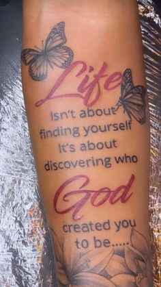 a person with a tattoo on their arm that says life isn't about finding yourself it's about discovering who god created you to be