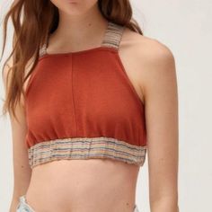 Nwot Urban Outfitters Ultra-Cropped Top In Rust Color Fitted With Stretchy Shoulder Straps That Cross At The Open Back High Neck Silhouette Trimmed With Stripped Elastic Band On The Straps And Bottom 60% Cotton 40% Polyester *Fits Like A Medium* Casual Cropped Halter Top With Stretch, Casual Cropped Stretch Halter Top, Casual Stretch Cropped Halter Top, Casual Fitted Halter Crop Top, Red Fitted Cropped Halter Top, Red Spring Crop Halter Top, Urban Outfitters Cotton Crop Top, Spring Red Crop Halter Top, Trendy Cotton Crop Top By Urban Outfitters