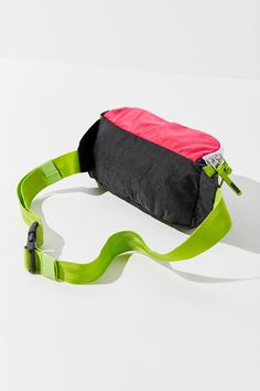 Perfect for giving your off-the-clock looks an instant does of street style, this PUMA fanny pack stands out from the crowded field of belt bags with sporty and vibrant colorblocking. DETAILS Fabric: Technical weave Rubber zip tassels Logo patch Zip at top Lined Weight: 5oz / 0.14kg Imported Measurements Height: 4.25in / 11cm Length: 13.5in / 34cm Depth: 3.5in / 9cm Belt length: 26.75-42.25in / 68-107cm City Block, Belt Bags, Designer Backpacks, Adjustable Belt, Fanny Pack, Belt Bag, Patch Logo, Color Blocking, Tassels