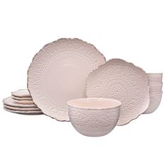 a set of white dishes and cups on a white background with no one in the photo