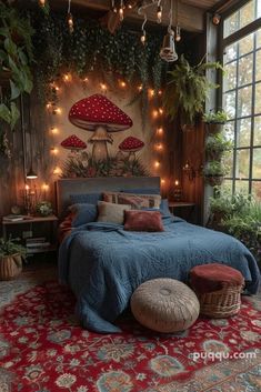 a bedroom decorated with plants and fairy lights is pictured in this image, the bed has a blue bedspread on it