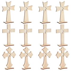 a set of six wooden crosses in different shapes