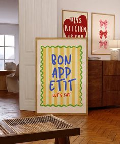 there is a sign that says bon appetit let's eat on the floor