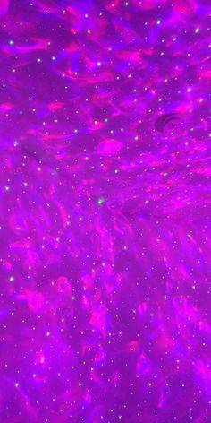 an abstract purple background with stars and bubbles in the water, as if it were liquid or gas