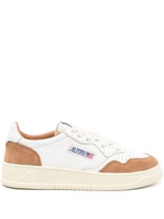 white/camel brown calf leather panelled design suede panelling logo patch to the side logo patch at the tongue branded heel counter logo at the sole round toe perforated toebox front lace-up fastening padded ankle French terry lining branded insole flat rubber sole This piece comes complete with a protective dust bag. Autry Sneakers, Logo Application, Sneaker Wedge, Yoga Wear, Sneaker Shopping, Manolo Blahnik, Sneakers White, Leather Sneakers, High Heel Shoes