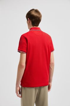 A timeless design that transcends seasons, this polo shirt is crafted from cotton pique. The classic style is embellished with a Moncler logo patch on the chest. Moncler Logo, Classic Red Polo Collar T-shirt, Polo Shirt White, Red Logo, Polo Sweater, Tri Color, Patch Logo, Scarlet, Mens Polo