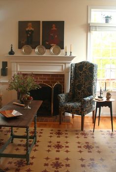 a living room filled with furniture and a fire place