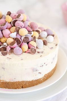 a cake with white frosting topped with lots of candy