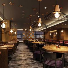 an empty restaurant with wooden tables and purple chairs, hanging lights over the dining area