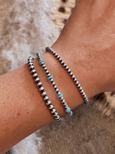 These beautiful authentic sterling silver navajo pearl bracelets are a staple piece that MUST be in every girls jewelry box! Great for wearing alone every day or layering with your other fave pieces. You can even wear as an anklet for a little extra kick. Available in 3mm, 4mm & 3mm with turquoise. 3mm with turquoise measure 7.25" from clasp to last hook 3mm & 4mm measures 9" from clasp to last hook Cheap Blue Western Style Jewelry, Cheap Western Blue Jewelry, Western Jewlery Sterling Silver, Trendy Beaded Jewelry Western, Cheap Western Style Blue Jewelry, Southern Jewelry Trends, Affordable Western Style Blue Jewelry, Affordable Blue Western Style Jewelry, Cute Preppy Country Jewelry