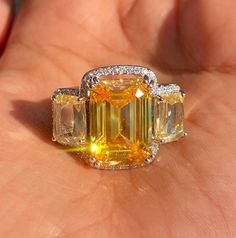 Yellow Diamond Ring featuring semi precious canary yellow stone and cz diamonds. Ideal to pair with your india western sarees and formal outfits. These large statement cocktail diamond ring will elevate your look. Perfect gift for her and gift for sister. *𝐏𝐑𝐎𝐃𝐔𝐂𝐓 𝐃𝐄𝐓𝐀𝐈𝐋* * 𝐌𝐚𝐭𝐞𝐫𝐢𝐚𝐥: Brass * 𝐏𝐥𝐚𝐭𝐢𝐧𝐠: White Rhodium Plated * 𝐒𝐭𝐨𝐧𝐞: AAA-quality CZ Diamond. 𝐕𝐢𝐬𝐢𝐭 𝐎𝐮𝐫 𝐅𝐀𝐐𝐬 𝐟𝐨𝐫 𝐒𝐡𝐢𝐩𝐩𝐢𝐧𝐠 𝐏𝐨𝐥𝐢𝐜𝐢𝐞𝐬 𝐚𝐧𝐝 𝐂𝐚𝐫𝐞 𝐈𝐧𝐬𝐭𝐫𝐮𝐜𝐭𝐢𝐨𝐧 *𝐃𝐈𝐒𝐂𝐋𝐀𝐈𝐌𝐄𝐑* * Product color may slightly vary due to photographic lighting sources or your screen settings. * Stone color may vary slightly due to variations in natural stones. *𝐒𝐈𝐌𝐈𝐋𝐀𝐑 𝐃𝐄𝐒𝐈𝐆𝐍* https://www.etsy.com/listing/1146740753/ Western Sarees, Cocktail Diamond Ring, Canary Yellow Diamonds, Yellow Sapphire Ring, Yellow Diamond Ring, Yellow Sapphire Rings, Yellow Diamond Rings, Formal Outfits, Diamond Cocktail Rings