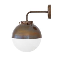 an old - fashioned wall light with a white ball on the side and a brown metal arm