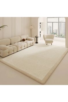 a large white rug in the middle of a living room