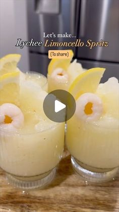 three glasses filled with food sitting on top of a wooden table