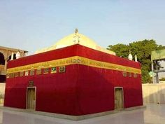 a large red building with gold trim around it