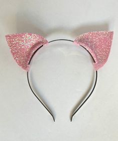 "These sparkly light pink cat ears are a fun headband to wear, for a party or even a holiday. I have used a soft light pink foam to create the ears and applied chunky iridescent glitter all over.  The ears measure about 2.5\" in width + in height. The ears are attached to a slim metal headband, which is a standard size.  Please contact me for any questions! :)" Pink Cat Ears, Sugar Glitter, Cat Ear Headband, Metal Headband, Rose Gold Sequin, Pink Animals, Rose Bonbon, Metal Headbands, Ears Headband