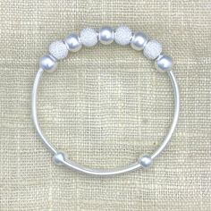 Pure Silver Baby Bangle, Baby Bead Anklet Silver, 999 Silver Jewel, Toddler Baby Bracelet, Adjustable Baby Bracelet, Baby Girl Baptism Gift This gorgeously made 999 silver baby children bracelet/anklet has two different-size beads that are moving freely on the bangle, to give away a adorable style. The length of the bracelet is adjustable and can be expanded from 5.5 inches to 6.5 inches. Definitely a great gift for newborn babies, a precious gift that will be cherished forever. Metal Details Me Baby Girl Baptism Gift, Silver Baby Bracelet, Gold Claddagh Ring, Anklet Silver, Toddler Bracelet, Bead Anklet, Adorable Style, Baby Bangles