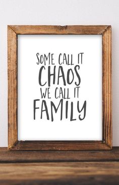 some call it chaos we call it family print in a wooden frame on a shelf