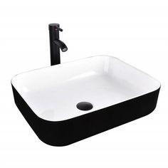 a black and white sink sitting under a faucet