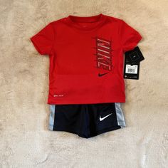 Nike Baby Boys Outfit Size 12 Months. Short Sleeve Shirt And Shorts. Red Shirt And Black Shorts. Brand New! Nike Sporty Short Sleeve Sets, Casual Red Shorts For Playtime, Nike Short Sleeve Sports Sets, Nike Sports Sets With Short Sleeve, Nike Sports Set With Short Sleeves, Nike Red Playwear Sets, Red Sporty Playwear Sets, Sporty Red Playwear Set, Red Sporty Playtime Sets