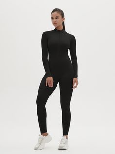 Why We Love It: The Hannah Long Sleeve Zipper Bodysuit is the epitome of sleek, modern activewear. This bodysuit combines functionality with a streamlined design, ensuring you look and feel your best whether you're at the gym or out and about. Fit and Features: Front Zipper Detail: The front zipper allows for easy wear and adjustability, adding a chic element to this versatile piece. Long Sleeves with Thumbholes: Provides added coverage and a secure fit, perfect for cooler weather or intense workouts. Buttery Soft Fabric: This bodysuit feels like a second skin, offering unmatched comfort and flexibility. High Performance: The four-way stretch material ensures maximum freedom of movement, making it ideal for any activity. Moisture-Wicking Technology: Keeps you dry and comfortable, no matter Sporty Second-skin Solid Activewear, Sleek High Stretch Black Unitard, Sleek High-stretch Black Unitard, Solid Color Second-skin Jumpsuits And Rompers For Workout, Solid Second-skin Jumpsuits And Rompers For Workout, Second-skin Jumpsuits And Rompers For Workout, Sleek Stretch Bodysuit For Sports, Sleek Sports Bodysuit Stretch Fit, Sleek Sports Bodysuit With Stretch