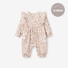 Our Woodland Print Organic Muslin Baby Jumpsuit is made of 100% GOTS-certified, sustainable, organic cotton muslin for easy, breathable fun in warmer temperatures. We added unique details like delicate fluttered sleeves, ruffled elastic leg and wrist hem, button closure on back and snap crotch. This organic baby jumpsuit features a whimsical woodland print and comes with a wooden hanger for pretty gifting. Make the outfit extra special and functional by pairing it with one of our signature cardi Dreamy Palette, Luxury Baby Gifts, Woodland Print, Baby Security Blanket, Muslin Baby, Elegant Baby, Jumpsuit Elegant, Baby Jumpsuit, Pink Jumpsuit