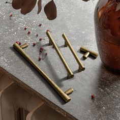 a vase filled with lots of small wooden sticks