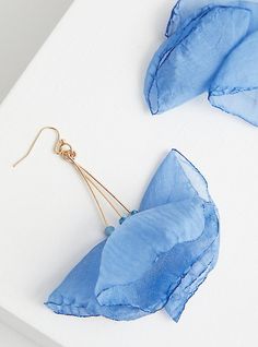 These statements earrings feature a delicate petal drop design and teal color. French hook backs. Base metal. Imported . 35mm - 57mm length. The best plus size women's light blue hanging earrings in blue. Blue Spring Earrings For Pierced Ears, Summer Light Blue Pierced Earrings, Elegant Light Blue Earrings For Summer, Blue Spring Earrings, Elegant Light Blue Summer Jewelry, Blue Dangle Earrings For Spring, Light Blue Drop Earrings For Summer, Blue Drop Flower Earrings With Ear Wire, Blue Drop Flower Earrings