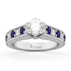 a diamond and blue sapphire engagement ring with the name allurez engraved on it