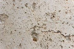 the cement has been chipped with holes in it