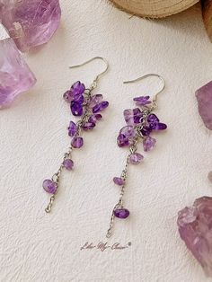 Sales Unit: Pairs The "Violet Dance Earrings" are a glowing mix of deep electric purple hues and textured gemstones that include amazing *micro-faceted* large purple Amethyst briolettes as the main stones.?The earrings create a dancing gemstone cascade - starting with small light gems they grow lo larger and deeper in color Amethyst briolettes mixed with Brazil Amethyst rondelles and finally completed with two gorgeous electric purple Amethyst briolettes.Full of mystery, elegance, grace, these a Floral Hair Crown, Dance Earrings, Electric Purple, Reindeer Headband, Purple Earrings, Swimsuit Dress, Floral Headbands, Crown Hairstyles, Amethyst Earrings