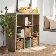 a shelf with baskets and lemons on it