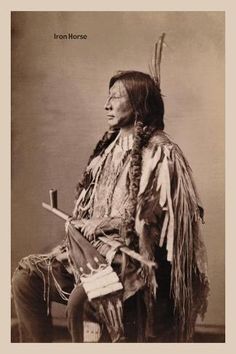 an old black and white photo of a native american man