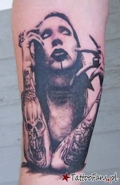 a tattoo with a woman's face surrounded by skulls and knives on her arm