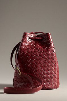 Leather; cotton lining One inner slip pocket Drawstring closure Imported | Adele Bucket Bag by Bembien in Red, Women's, Cotton/Leather at Anthropologie Red Intrecciato Weave Tote Bag, Red Tote Bag With Intrecciato Weave, Elegant Red Shoulder Bag With Intrecciato Weave, Red Woven Leather Shoulder Bag For Travel, Red Intrecciato Weave Shoulder Bag For Daily Use, Chic Red Bag With Intrecciato Weave, Chic Red Bags With Intrecciato Weave, Elegant Red Woven Leather Bag, Chic Red Woven Leather Bag