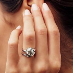 a close up of a person wearing a ring