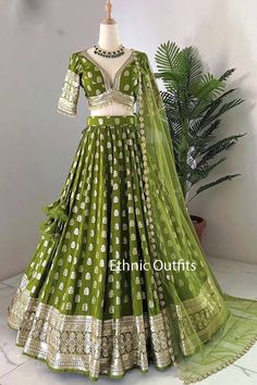 Welcome to ethnic outfits. As a dedicated small business, we are thrilled to share our passion for handcrafted ethnic wear with you. From the moment you place an order, we take care of every detail, ensuring a seamless experience from start to finish. We carefully source premium fabrics and handle all the embroidery in-house, combining both machine and intricate handwork. Our expertise also extends to printing, beading, and adding stunning embellishments like stones, mirrors, and more. Each piece is crafted with precision and care, ensuring it meets our highest standards of quality and elegance. We only start making the outfit after confirming your customized size details. Handling time: No need to worry, simply let us know your preferred delivery date, and we will ensure the order is proc Fitted Green Lehenga With Cutdana, Reception Choli With Gota Work In Banarasi Silk, Reception Banarasi Silk Choli With Gota Work, Banarasi Silk Choli With Gota Work For Reception, Green Cutdana Lehenga For Wedding, Semi-stitched Pista Green Choli With Gota Work, Bollywood Style Choli In Pista Green With Gota Work, Pista Green Choli With Gota Work For Diwali, Fitted Sharara With Gota Work For Transitional Season