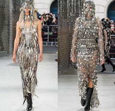 Paco Rabanne 2021 Spring Summer Womens Runway Catwalk Looks Collection - Mode à Paris Fashion Week France - Streets Medieval Chainmail Mesh Bedazzled Gems Jewels Discs Assemblage Metal Plates Armor Sequins Beads Bralette Lingerie Intimates Dress Lace Embroidery Leopard Cheetah Flowers Floral Knit Turtleneck Sweater Plastic Trench Coat Capelet Corset Gown Tied zipper Stripes Plaid Check Slit Holes Drum Corps Marching Band Vest Purse Handbag Steel Rod Heels Boots Chainmail Runway, France Streets, Medieval Chainmail, Corset Gown, Drum Corps, Catwalk Collection, Chain Dress, Paris Mode, Metal Plates