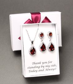 "Burgundy bridesmaid earrings Dark red tear drop earrings Bridesmaid gift bridesmaid necklace bracelet bridesmaid jewelry This set features AAA top burgundy CZ crystal posts matched with bottom tear drop burgundy pendants, and matching necklace and bracelet set. They are in Rose gold, Gold and White gold (silver colored) plated settings, nickel and lead safe, and are tarnish resistant. Earrings measure 1.25 (31mm) inches in lengths.  Clip on earrings for non pierced ears are also available, please leave a note at checkout. Necklace measures 16 inches with extensions adjustable to 18.5 inches. Other lengths are also available at your request.  Burgundy bracelet measures 6.5 -7.5 inches with removeable extender links.  Please leave a note in the \"add a note to seller\" box at checkout for c Red Drop Jewelry For Anniversary, Sterling Silver Jewelry Sets For Wedding On Valentine's Day, Elegant Teardrop Jewelry Sets For Gift, Red Teardrop Jewelry With Matching Earrings, Pear-shaped Jewelry For Valentine's Day Gift, Red Drop Jewelry For Formal Occasions, Valentine's Day Gift Pear-shaped Jewelry, Valentine's Day Wedding Jewelry With Matching Earrings, Mother's Day Formal Jewelry With Matching Earrings