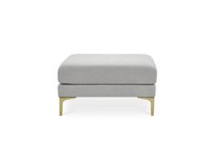 the footstool in grey fabric with gold legs and wooden feet, on a white background