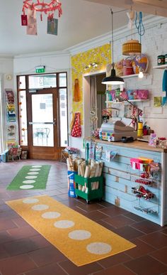 the inside of a child's playroom with lots of toys and accessories on display