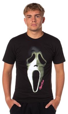 a man wearing a black shirt with a ghost face on it