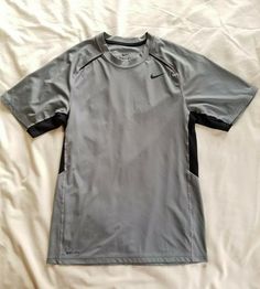 Nike Gray athletic tee Men's Size S @boyds_boutique W Gray Short Sleeve Sports Shirt, Nike Gray Crew Neck Shirt, Nike Gray Short Sleeve Shirt, Nike Athletic Fit Sports T-shirt, Nike Athletic Fit T-shirt For Training, Nike Short Sleeve Shirt With Moisture-wicking, Nike Sports T-shirt In Gray, Nike Functional T-shirt For Sports, Nike Short Sleeve T-shirt For Gym