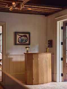 an empty room with a wooden desk in it