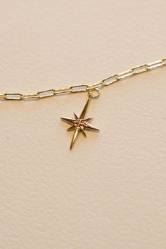 14k Gold filled North Star Charm to guide your way. This charm adds a bit of shine and fun shape to every necklace. Hand make your custom charm necklace in Laguna Beach or build your piece online through adding a base necklace and your selection of charms. Leave us a note on your order for any special requests. 14K gold filled Tarnish resistant 2.5 cm tall Everyday Star-shaped Jewelry With Charms, 14k Gold Filled Star Charm Jewelry, 14k Gold-filled Star Charm Jewelry, Everyday 14k Gold Jewelry With Star Charm, Yellow Gold Star Charm Pendant Necklace, 14k Gold Filled Star Charm Necklace As A Gift, 14k Gold-filled Star Charm Necklace As Gift, Gold Star-shaped Jewelry With Charms, Celestial Jewelry With Starburst Star Charm