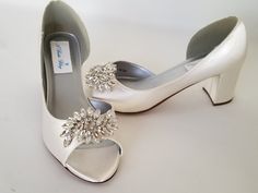 "Dyeable satin bridal shoes with sparkling crystal applique. These beautiful satin wedding shoes have an approximately heel height of 2 1/4 inches. The listing picture shows the shoes in ivory. You can have the shoes dyed any of my chart colors, white, or a designer color. You can also send us a sample swatch to match your color * All dyed shoes can bleed when exposed to moisture. If you would like to protect your shoes please consider purchasing my water repellent service. You can purchase this Wedding Shoes Block Heel, Blue Bridal Shoes, Navy Wedding Shoes, Satin Wedding Shoes, Custom Wedding Shoes, Ivory Bridal Shoes, Royal Blue Shoes, How To Dye Shoes, Shoes Chunky