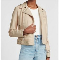 Cream Beige Leather Biker Jacket For Work, Beige Leather Biker Jacket For Fall, Beige Biker Jacket With Zipper For Spring, Spring Moto Biker Jacket With Zipper, Spring Beige Biker Jacket With Zipper Closure, Spring Moto Biker Jacket With Zipper Closure, Trendy Beige Biker Jacket For Spring, White Moto Biker Jacket For Spring, Spring Leather Biker Jacket With Zipper