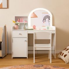 a child's desk and chair in a room with a rug on the floor