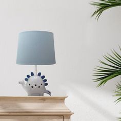 a lamp that is on top of a dresser